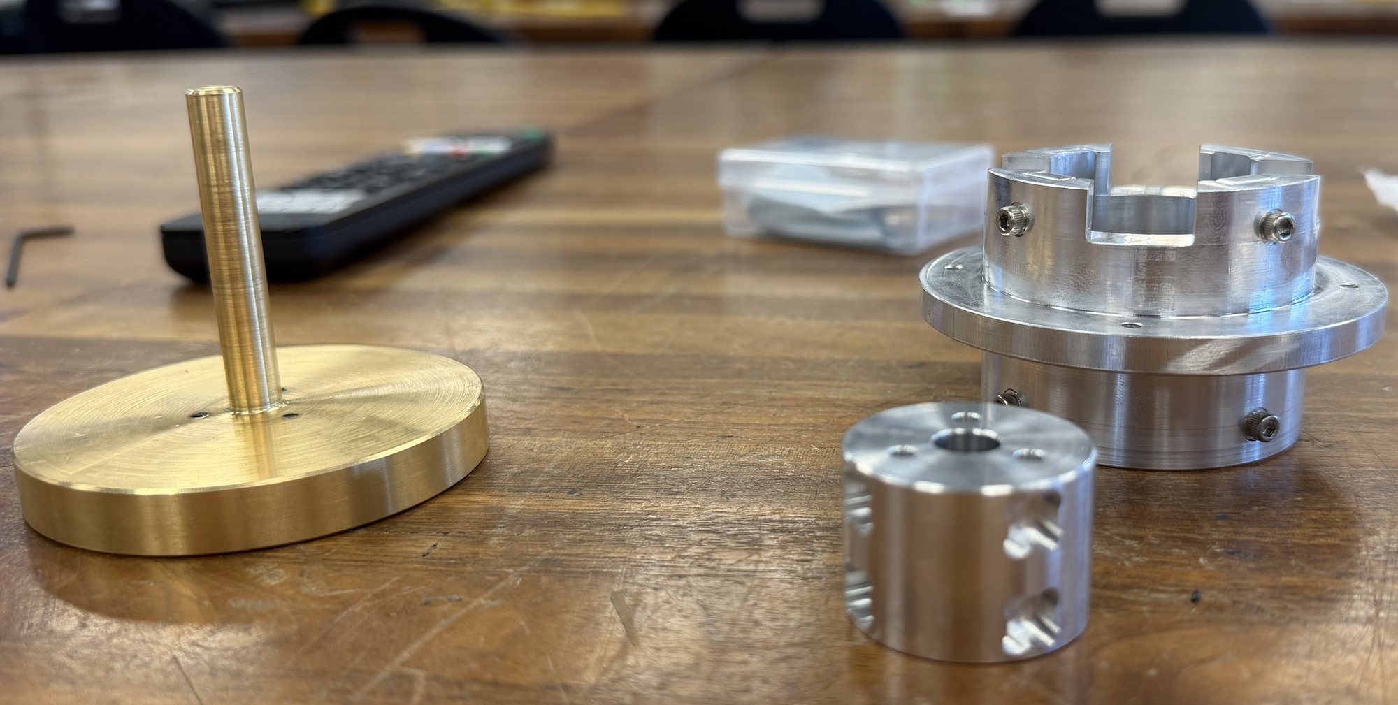 Machined brass flywheel and shaft, aluminum housing and magnet journal