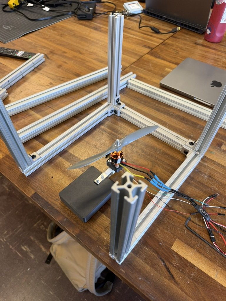 The stand's 80/20 frame going together, with the motor mounted on the load cell